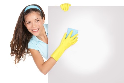 Technician using PPE during a carpet cleaning service